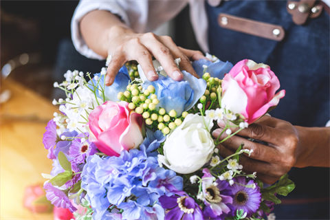 Person arranging flowers