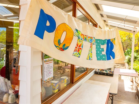 A sign outside a building, with the word 