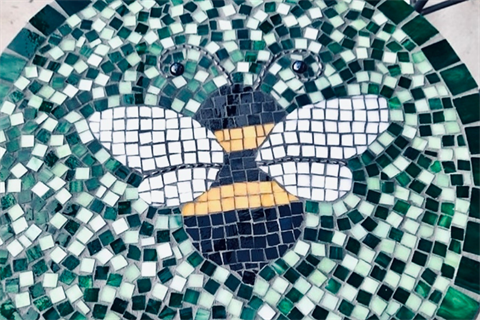 Mosaic table with bee pattern